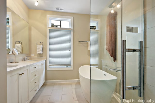 358 W Huron St Unit B, Chicago, IL 60654 - bathroom featuring double vanity, a soaking tub, tile patterned flooring, and an enclosed shower