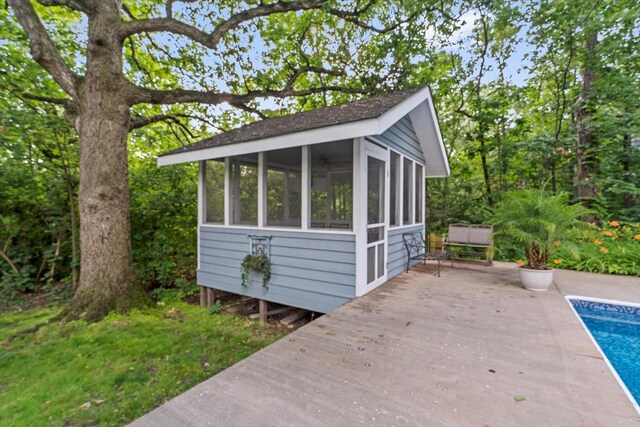 13302 Archer Ave, Lemont, IL 60439 - view of outdoor structure with a sunroom and an outdoor pool