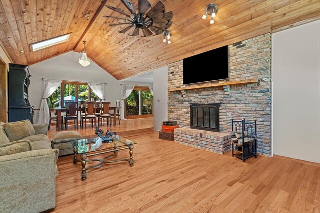 13302 Archer Ave, Lemont, IL 60439 - living room with wood finished floors, a brick fireplace, a skylight, wood ceiling, and ceiling fan