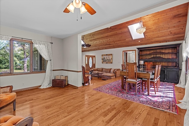 13302 Archer Ave, Lemont, IL 60439 - dining area with a skylight, wood finished floors, vaulted ceiling, and a ceiling fan