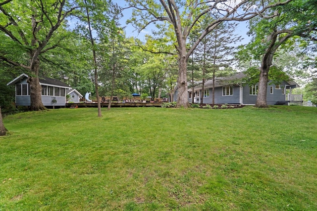 13302 Archer Ave, Lemont, IL 60439 - view of green lawn with a sunroom and a wooden deck