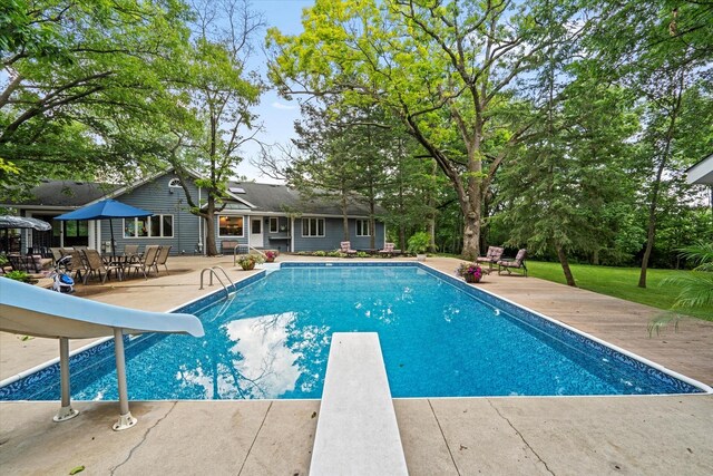 13302 Archer Ave, Lemont, IL 60439 - outdoor pool with a diving board, a water slide, and a patio area