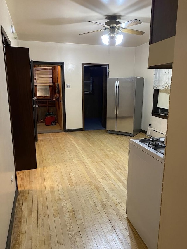5015 S Talman Ave, Chicago, IL 60632 - kitchen featuring freestanding refrigerator, white stove, light wood-style flooring, and ceiling fan