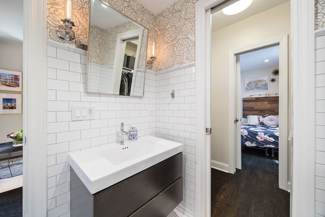 2012 W Charleston St, Chicago, IL 60647 - ensuite bathroom featuring tile walls, vanity, and wood finished floors