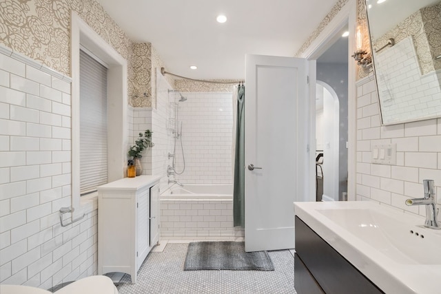 2012 W Charleston St, Chicago, IL 60647 - full bath with tile walls, tiled shower / bath combo, vanity, tile patterned floors, and wallpapered walls