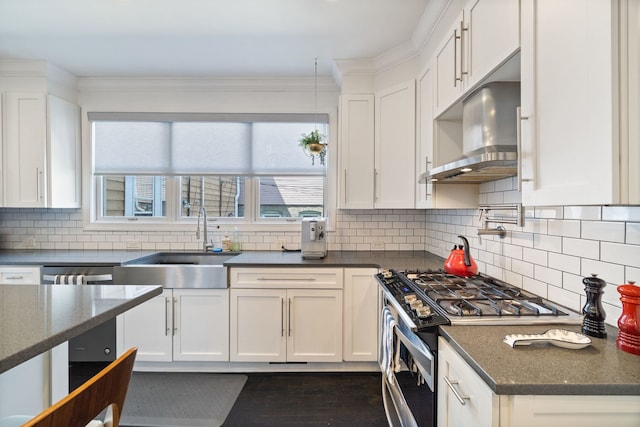 2012 W Charleston St, Chicago, IL 60647 - kitchen featuring appliances with stainless steel finishes, white cabinets, decorative backsplash, and ornamental molding