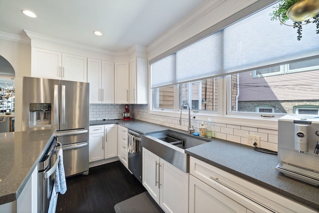 2012 W Charleston St, Chicago, IL 60647 - kitchen featuring appliances with stainless steel finishes, crown molding, dark wood-type flooring, white cabinets, and recessed lighting