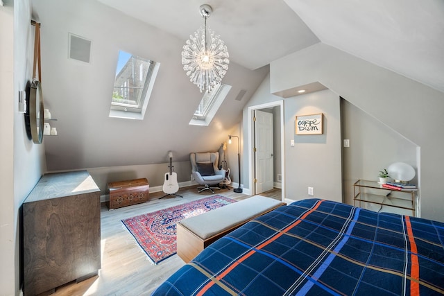 2012 W Charleston St, Chicago, IL 60647 - bedroom featuring vaulted ceiling, a skylight, wood finished floors, and a chandelier