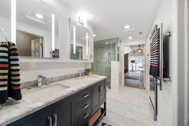 2012 W Charleston St, Chicago, IL 60647 - bathroom featuring double vanity, a shower stall, and recessed lighting