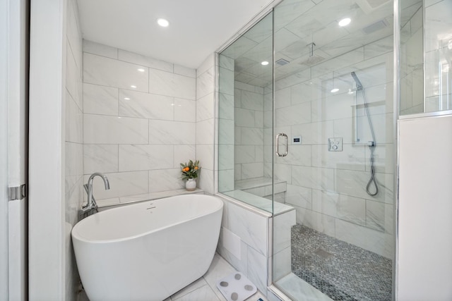 2012 W Charleston St, Chicago, IL 60647 - full bath featuring tile walls, a freestanding bath, a stall shower, and recessed lighting