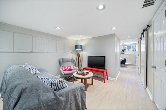2012 W Charleston St, Chicago, IL 60647 - living area featuring light wood-style flooring, a barn door, and recessed lighting