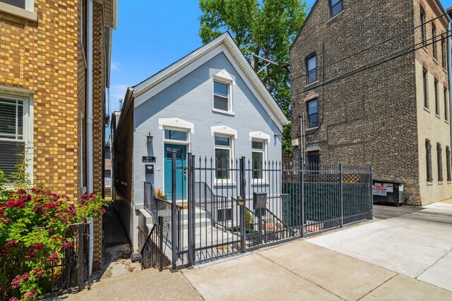 2012 W Charleston St, Chicago, IL 60647 - view of front facade with brick siding and a gate