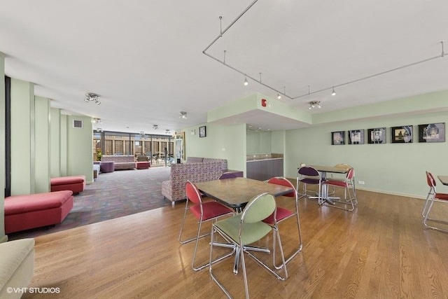 100 E Walton St Unit 40A, Chicago, IL 60611 - dining area featuring wood finished floors and track lighting