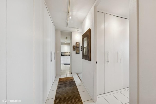100 E Walton St Unit 40A, Chicago, IL 60611 - hall with light tile patterned flooring and rail lighting
