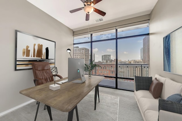 520 S State St Unit 1726, Chicago, IL 60605 - home office featuring a wall of windows, carpet, a view of city, and a ceiling fan