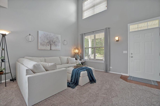 1854 Westridge Pl, Aurora, IL 60504 - carpeted living area with a towering ceiling and baseboards