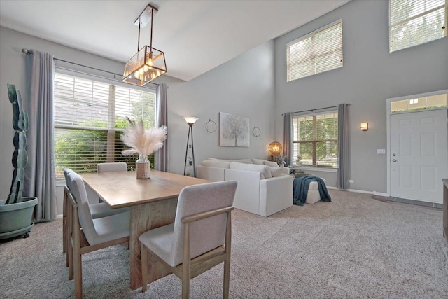 1854 Westridge Pl, Aurora, IL 60504 - dining space featuring carpet flooring, a towering ceiling, and a chandelier