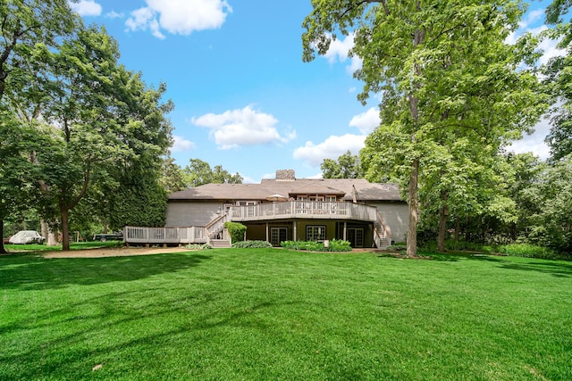 25115 W Cedarwood Ln, Ingleside, IL 60041 - back of property with stairway, a deck, and a lawn