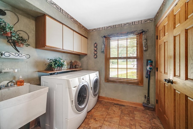 25115 W Cedarwood Ln, Ingleside, IL 60041 - laundry room featuring cabinet space, separate washer and dryer, and light stone finish flooring