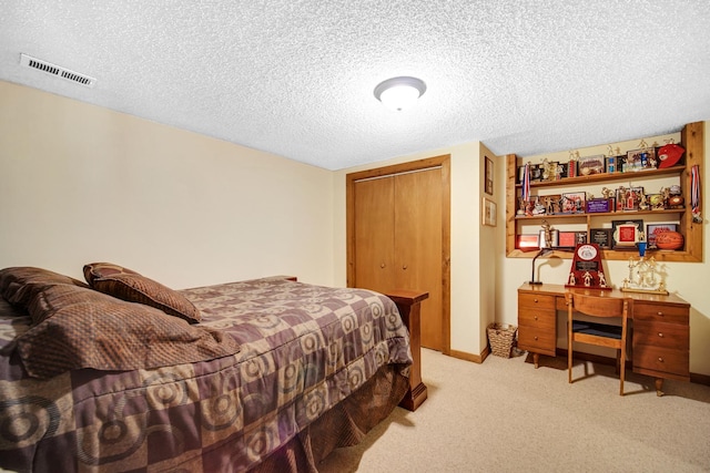 25115 W Cedarwood Ln, Ingleside, IL 60041 - bedroom featuring light colored carpet, a closet, and a textured ceiling