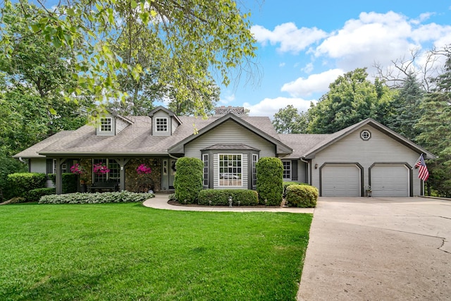 25115 W Cedarwood Ln, Ingleside, IL 60041 - cape cod home featuring a garage, a front yard, driveway, and a shingled roof
