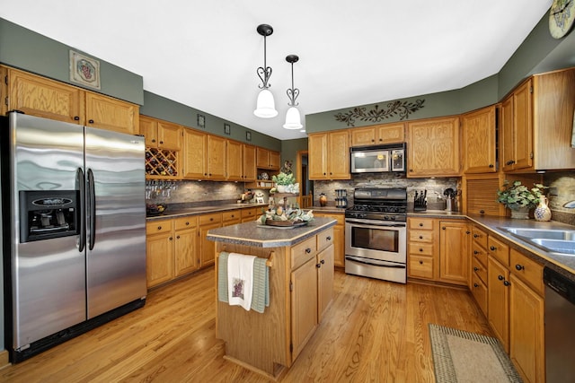 25115 W Cedarwood Ln, Ingleside, IL 60041 - kitchen with stainless steel appliances, dark countertops, tasteful backsplash, and a center island