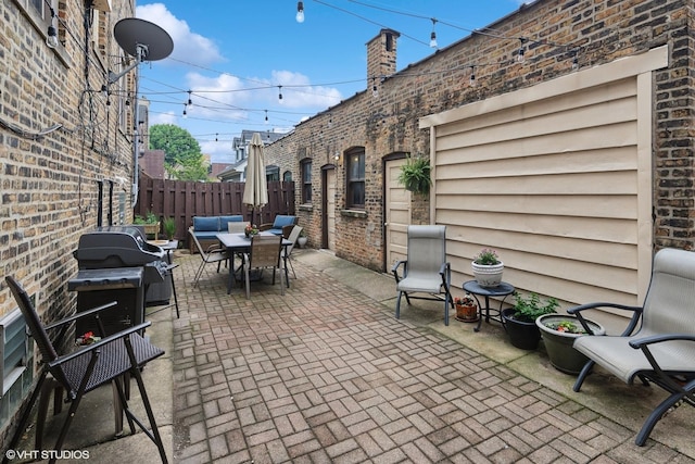 4850 N Oakley Ave Unit 1R, Chicago, IL 60625 - view of patio featuring outdoor dining space and a grill