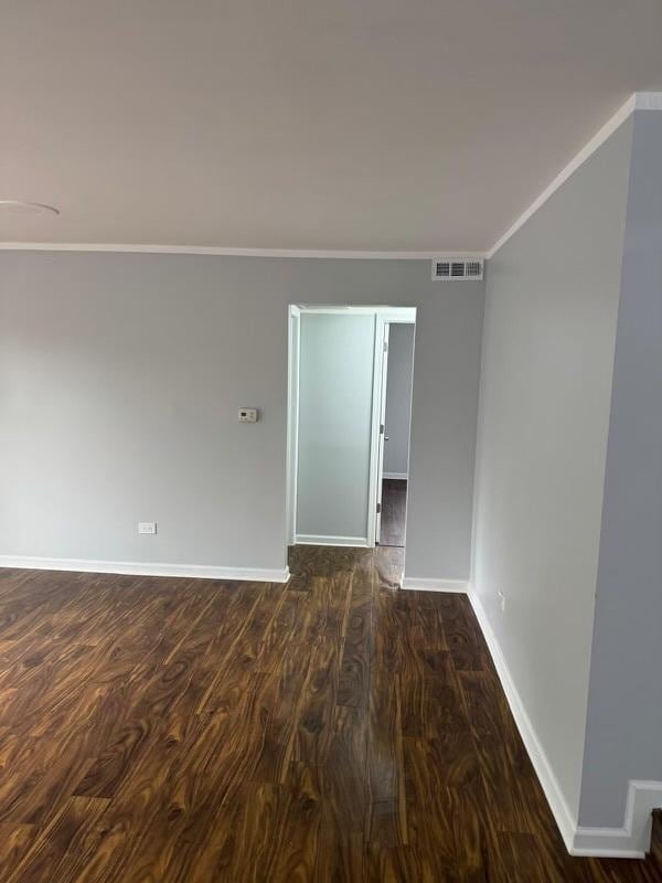 5204 Midlothian Tpke Unit 222, Crestwood, IL 60418 - unfurnished room featuring ornamental molding and dark wood-type flooring