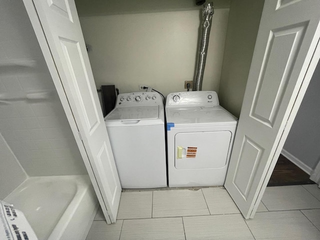 5204 Midlothian Tpke Unit 222, Crestwood, IL 60418 - washroom with washer and clothes dryer and light tile patterned flooring