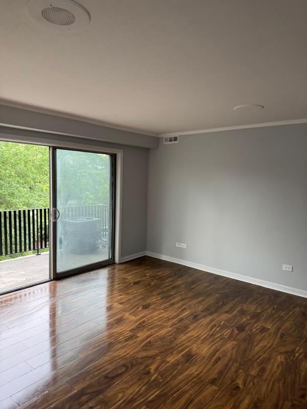 5204 Midlothian Tpke Unit 222, Crestwood, IL 60418 - empty room featuring dark wood finished floors and crown molding