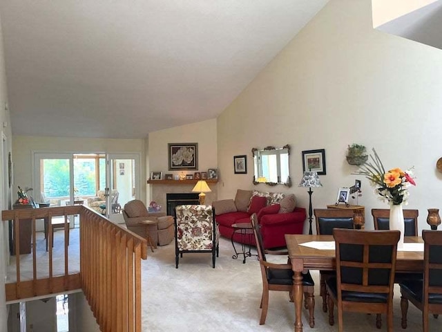 W4782 Potter Rd Unit 2, Elkhorn, WI 53121 - living room featuring vaulted ceiling, light carpet, and a fireplace
