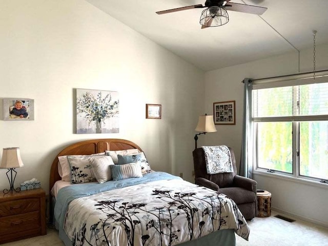 W4782 Potter Rd Unit 2, Elkhorn, WI 53121 - bedroom with light colored carpet, vaulted ceiling, multiple windows, and a ceiling fan