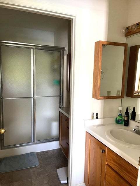 W4782 Potter Rd Unit 2, Elkhorn, WI 53121 - bathroom featuring vanity and a stall shower