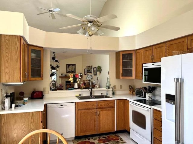 W4782 Potter Rd Unit 2, Elkhorn, WI 53121 - kitchen with white appliances, brown cabinetry, a ceiling fan, glass insert cabinets, and light countertops