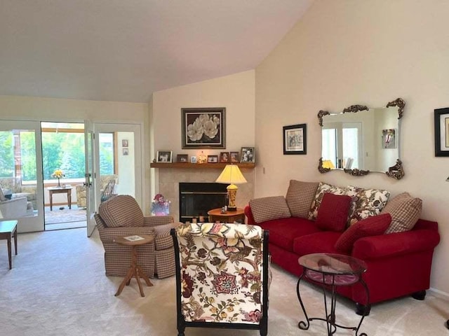 W4782 Potter Rd Unit 2, Elkhorn, WI 53121 - carpeted living area with vaulted ceiling, plenty of natural light, and a glass covered fireplace
