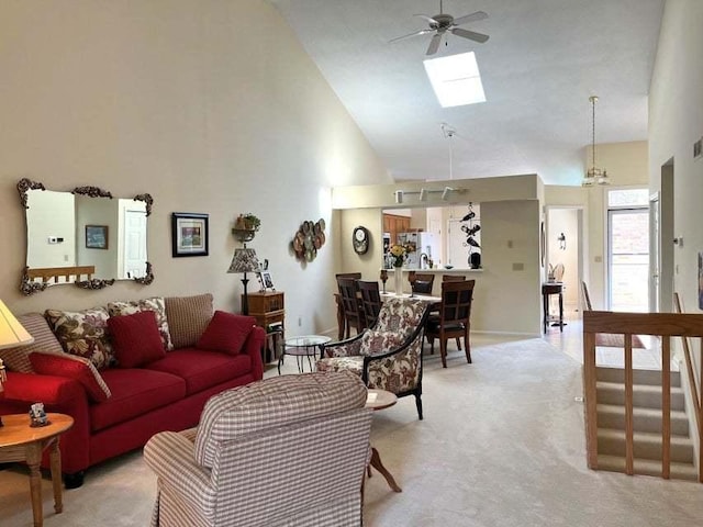 W4782 Potter Rd Unit 2, Elkhorn, WI 53121 - living area featuring a ceiling fan, high vaulted ceiling, a skylight, and light carpet