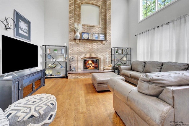 1880 Crofton Dr, Algonquin, IL 60102 - living room featuring wood finished floors, a towering ceiling, and a fireplace