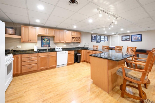 1880 Crofton Dr, Algonquin, IL 60102 - kitchen featuring white appliances, a breakfast bar, light wood-style floors, dark stone counters, and a drop ceiling