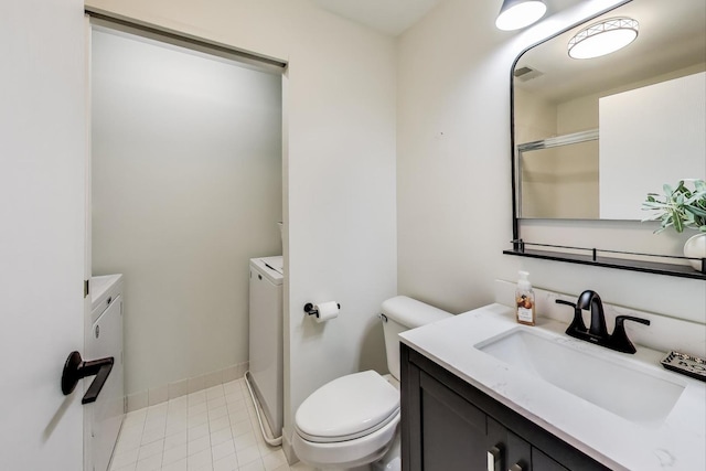 110 S Evergreen Ave Unit 4Cs, Arlington Heights, IL 60005 - bathroom featuring separate washer and dryer, vanity, and a shower with shower door
