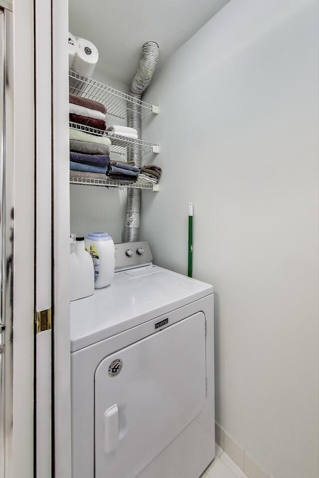 110 S Evergreen Ave Unit 4Cs, Arlington Heights, IL 60005 - laundry room featuring washer / dryer and light tile patterned floors