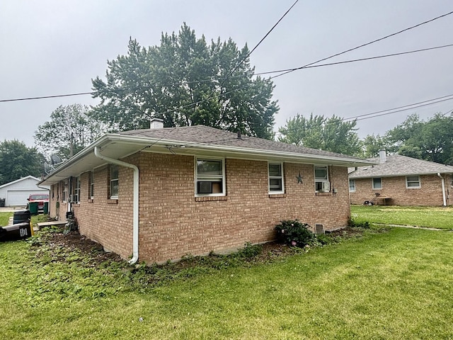 328 W Harrison St, Belvidere, IL 61008 - view of side of home featuring brick siding, a lawn, and a chimney
