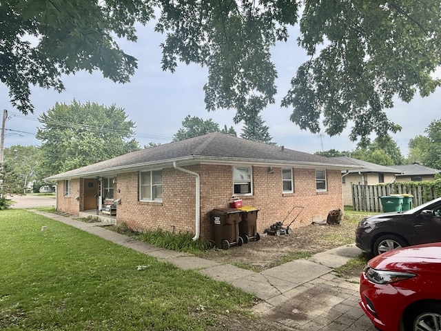 328 W Harrison St, Belvidere, IL 61008 - view of side of home with brick siding and roof with shingles