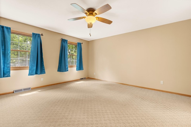 7204 Warblers Way, Roscoe, IL 61073 - carpeted empty room with plenty of natural light and a ceiling fan