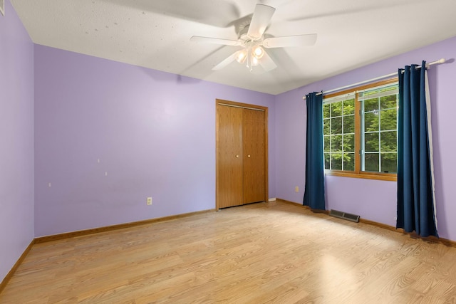 7204 Warblers Way, Roscoe, IL 61073 - empty room with light wood-style flooring and ceiling fan