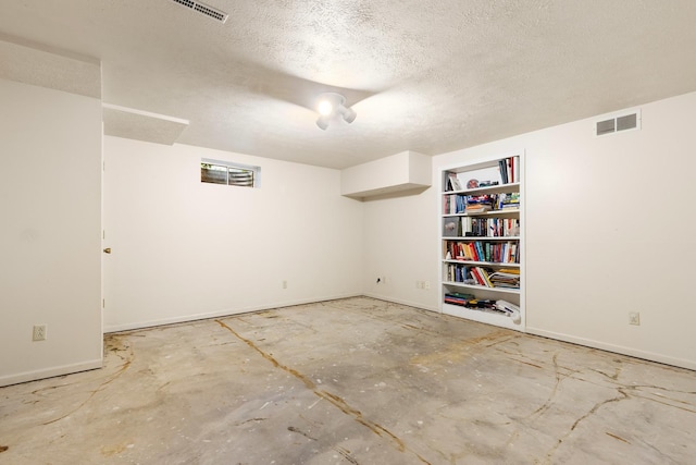 7204 Warblers Way, Roscoe, IL 61073 - finished basement featuring a textured ceiling and built in features