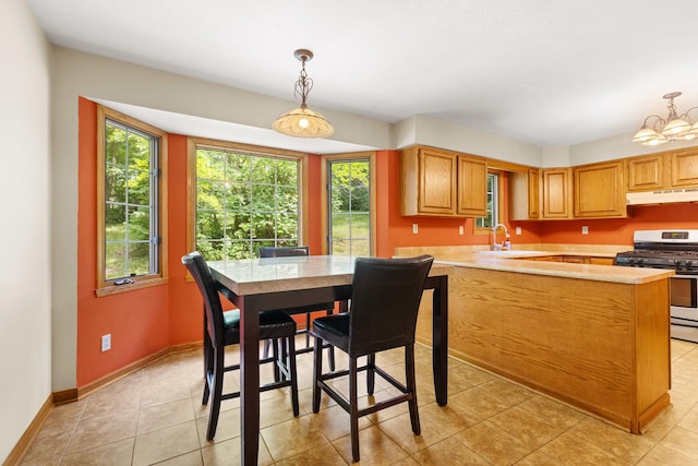 7204 Warblers Way, Roscoe, IL 61073 - dining space with light tile patterned flooring and a chandelier