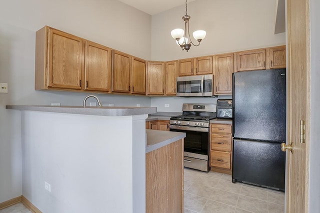 1335 Acorn Dr, Crest Hill, IL 60403 - kitchen with appliances with stainless steel finishes, a peninsula, light tile patterned floors, decorative light fixtures, and a chandelier