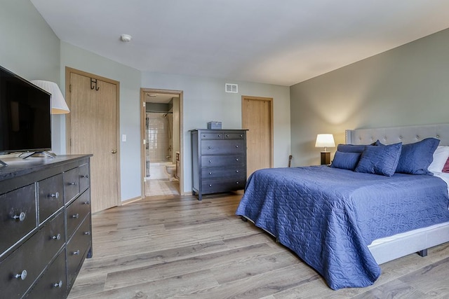 1335 Acorn Dr, Crest Hill, IL 60403 - bedroom with light wood-style flooring and ensuite bathroom