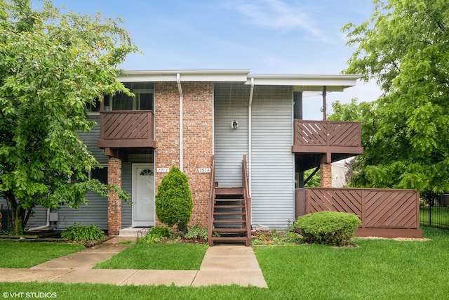 7914 164th Ct Unit 0, Tinley Park, IL 60477 - view of front of home with a balcony and brick siding