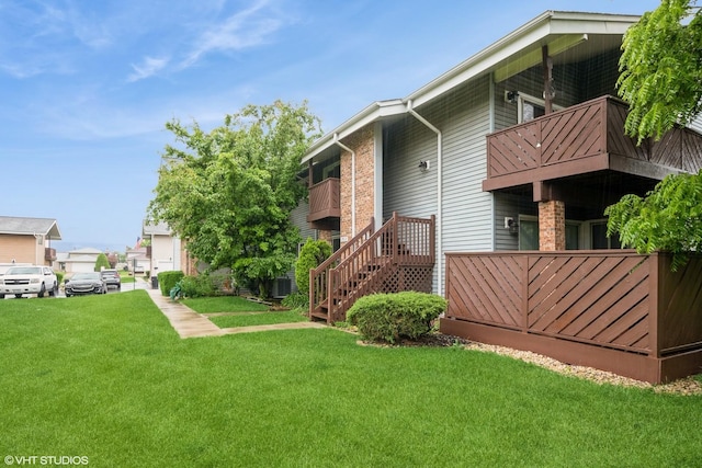 7914 164th Ct Unit 0, Tinley Park, IL 60477 - view of green lawn featuring a balcony and stairs